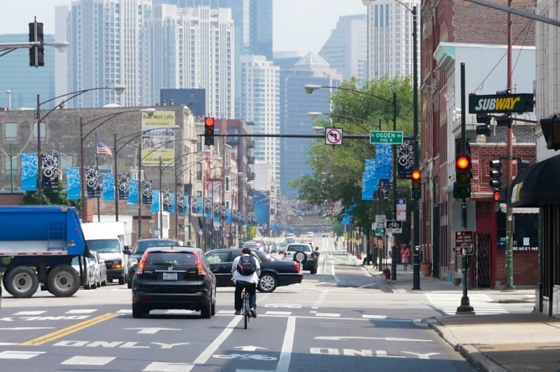 a person riding a bicycle in an intersection