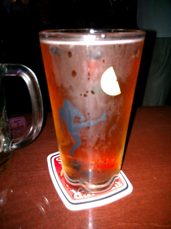 a pitcher and a glass on a table