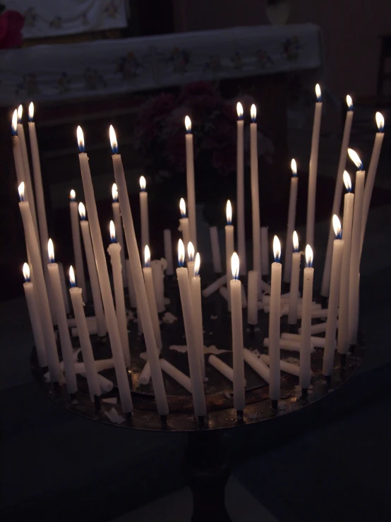 candles in a candleholder on a dining table