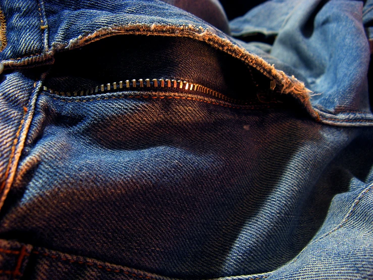 there is a small zipper in the back pocket of a pair of jeans