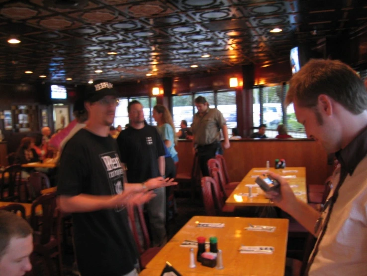 a group of people sitting at a dining table