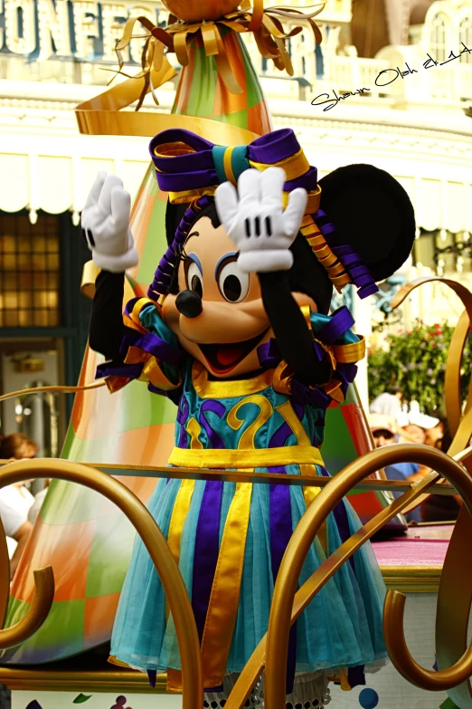 a colorful mickey mouse float in a parade