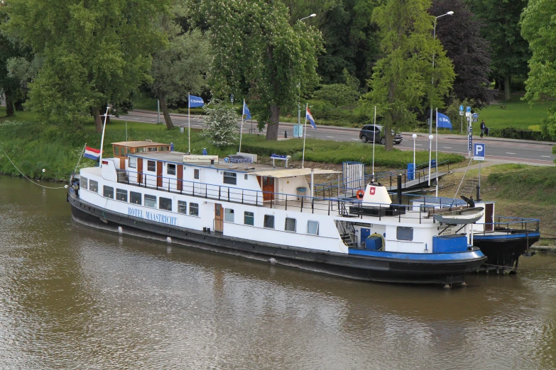 a boat in the water parked next to other boats