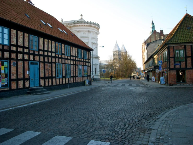 a street with people and buildings on both sides