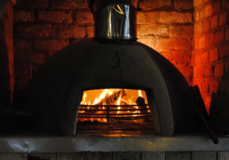 a fireplace with a big oven on it