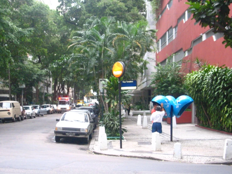 a city street filled with cars and trees