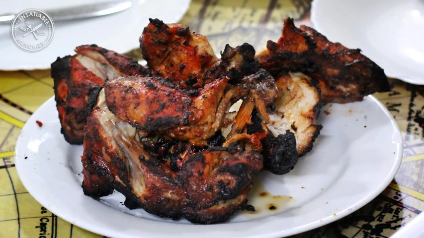 chicken wings are arranged on a white plate