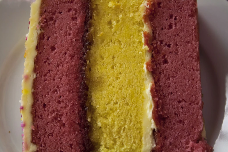 a white plate topped with a three layer cake