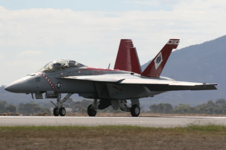 an air force jet on a runway at airport