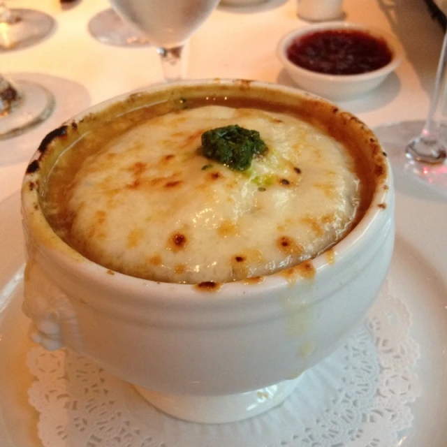 a bowl filled with food sits on a plate