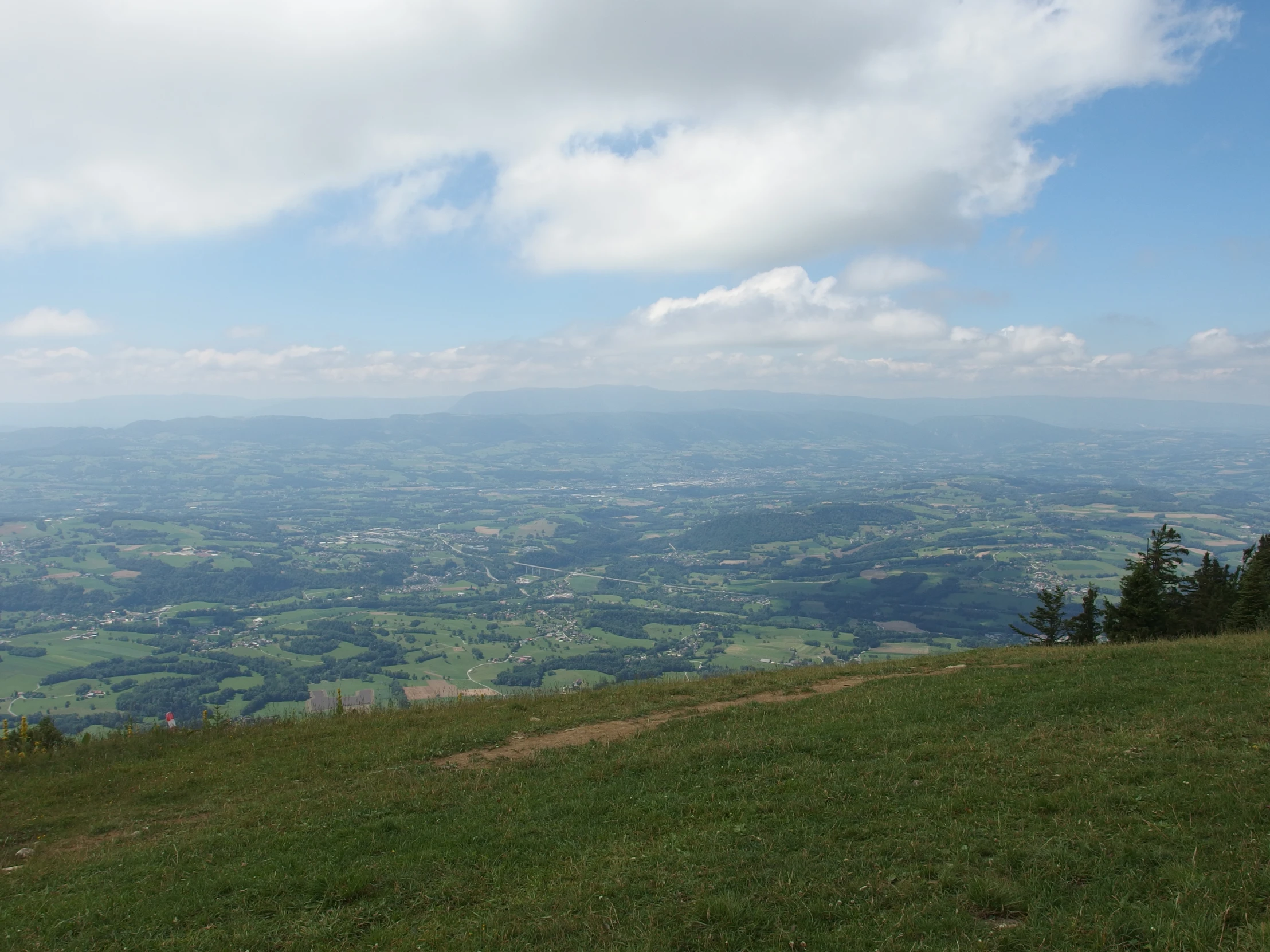 a view of an open countryside, with lots of grass