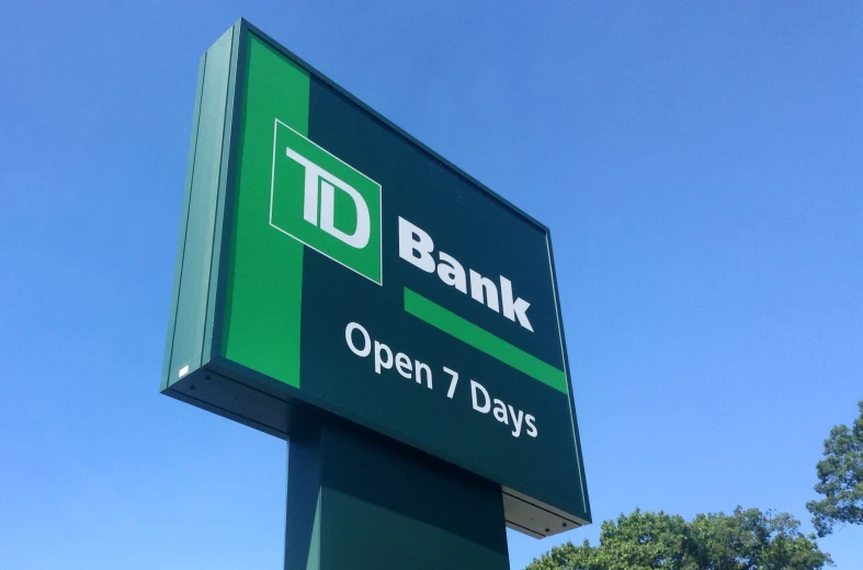 a sign for a bank with the letters open 7 days