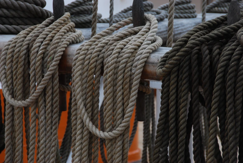 various ropes are hanging on a wire, making them look old
