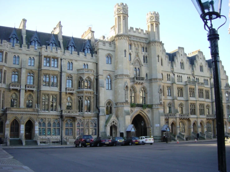 cars parked in front of a large building