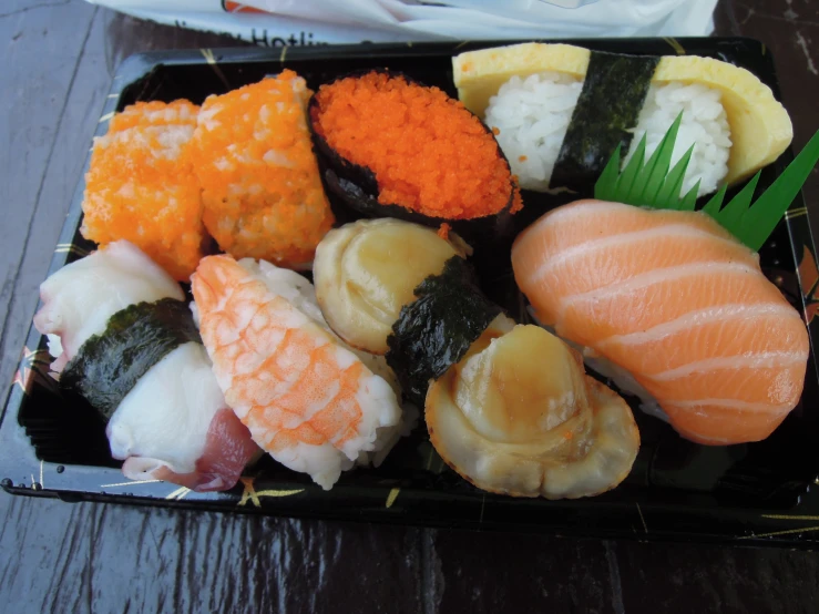a tray full of different sushi is shown