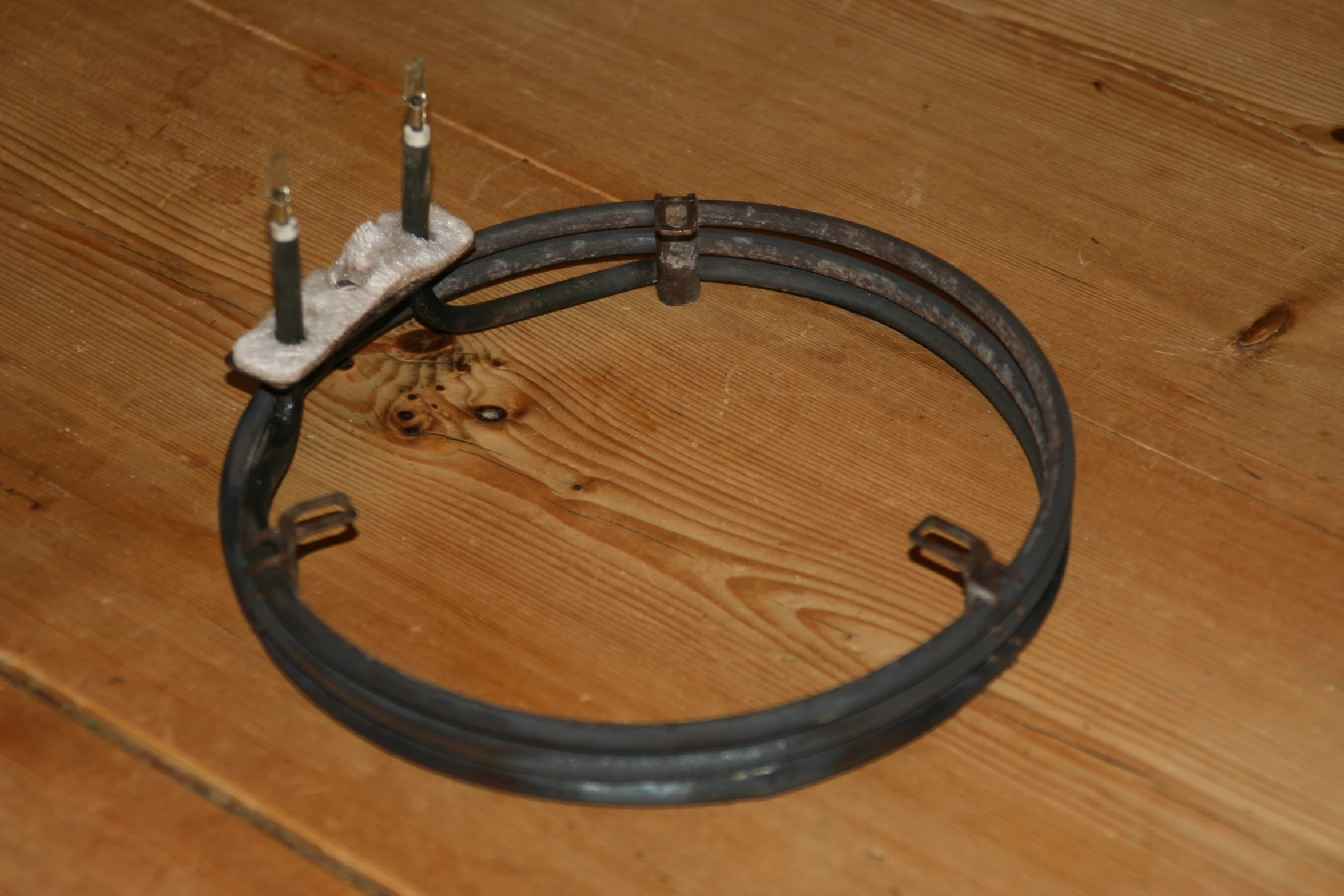 the cord of a black electric motor is pulled apart