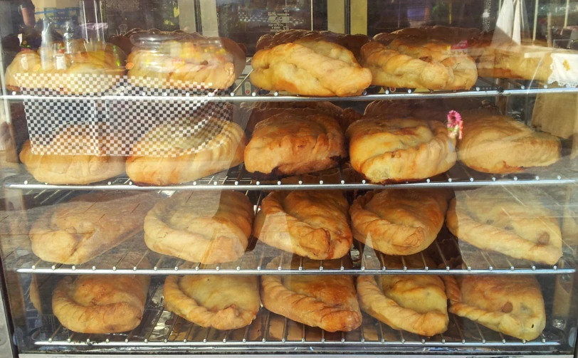 some very pretty big nice breads in a case