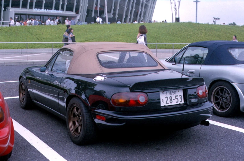 a number of cars parked in a parking lot