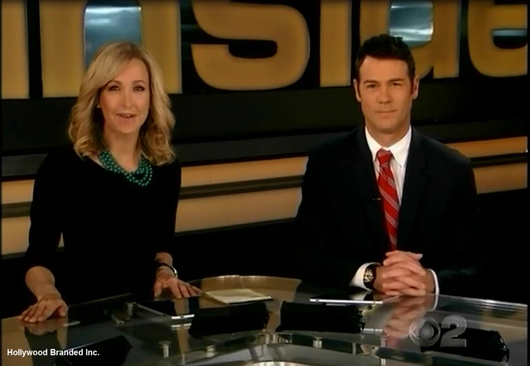 a picture of two people on the set of news