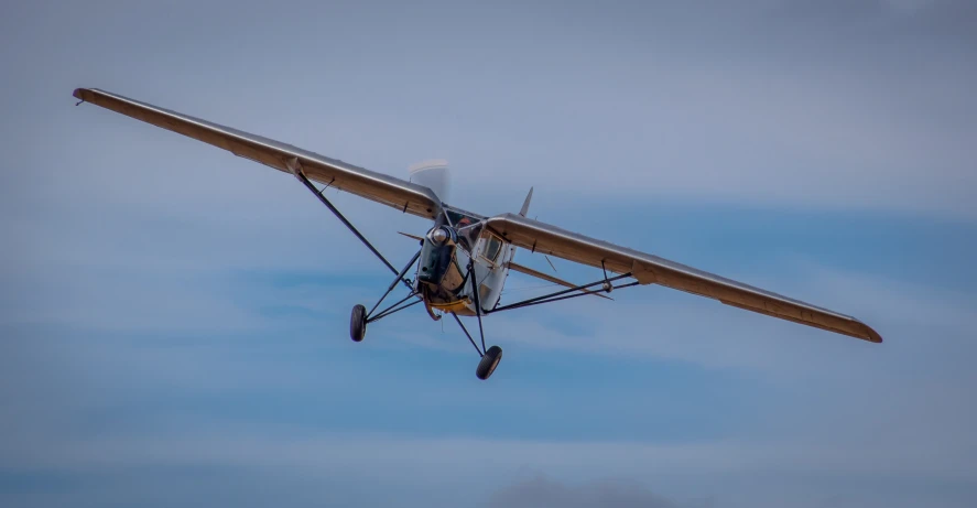 a small airplane is flying through the air