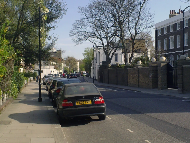 a car is parked at the curb waiting for passengers