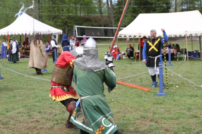 a group of people with knights dressed in medieval garb