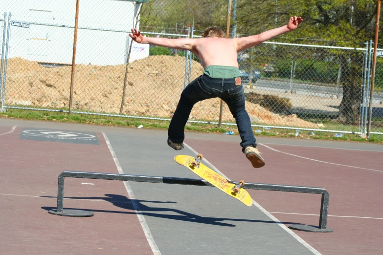 a person jumping in the air on a skateboard