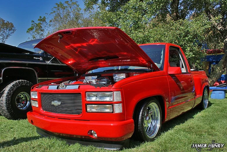 this is an image of a pickup truck with its hood open