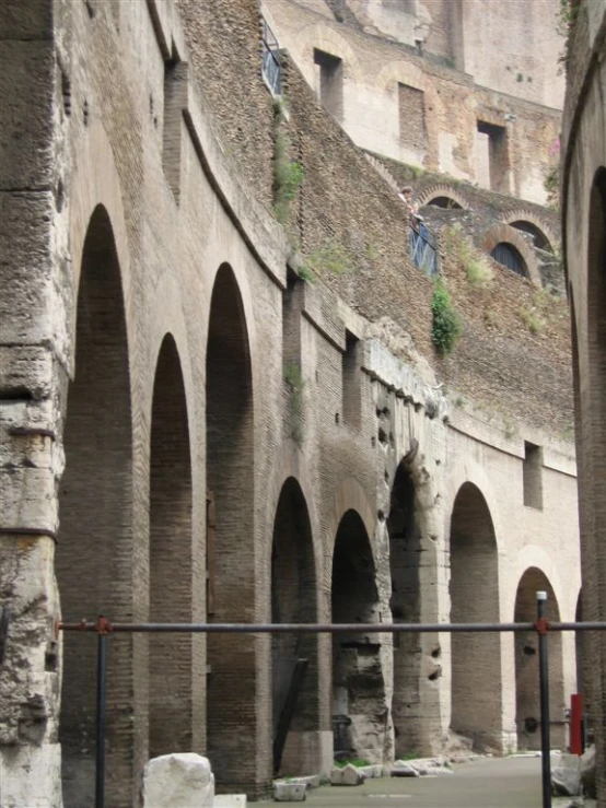 a group of arches in a courtyard next to a building