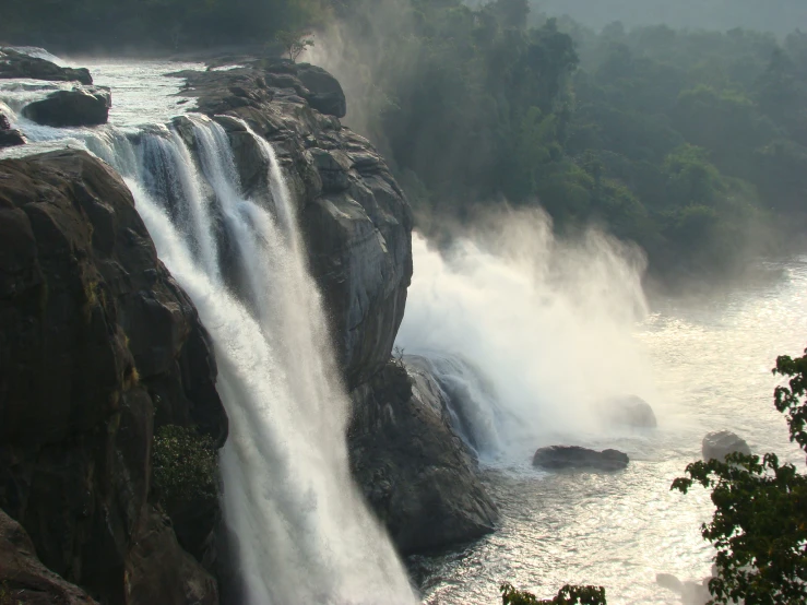 a large waterfall has water falling down it