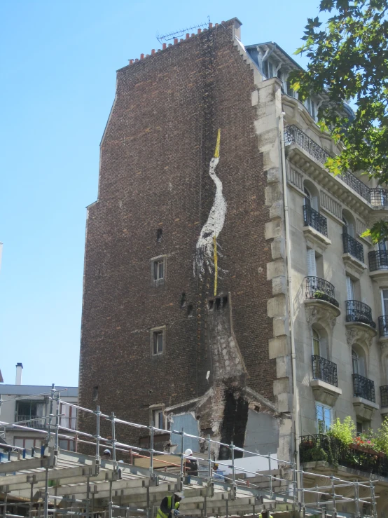 some kind of tall building that is next to a tree