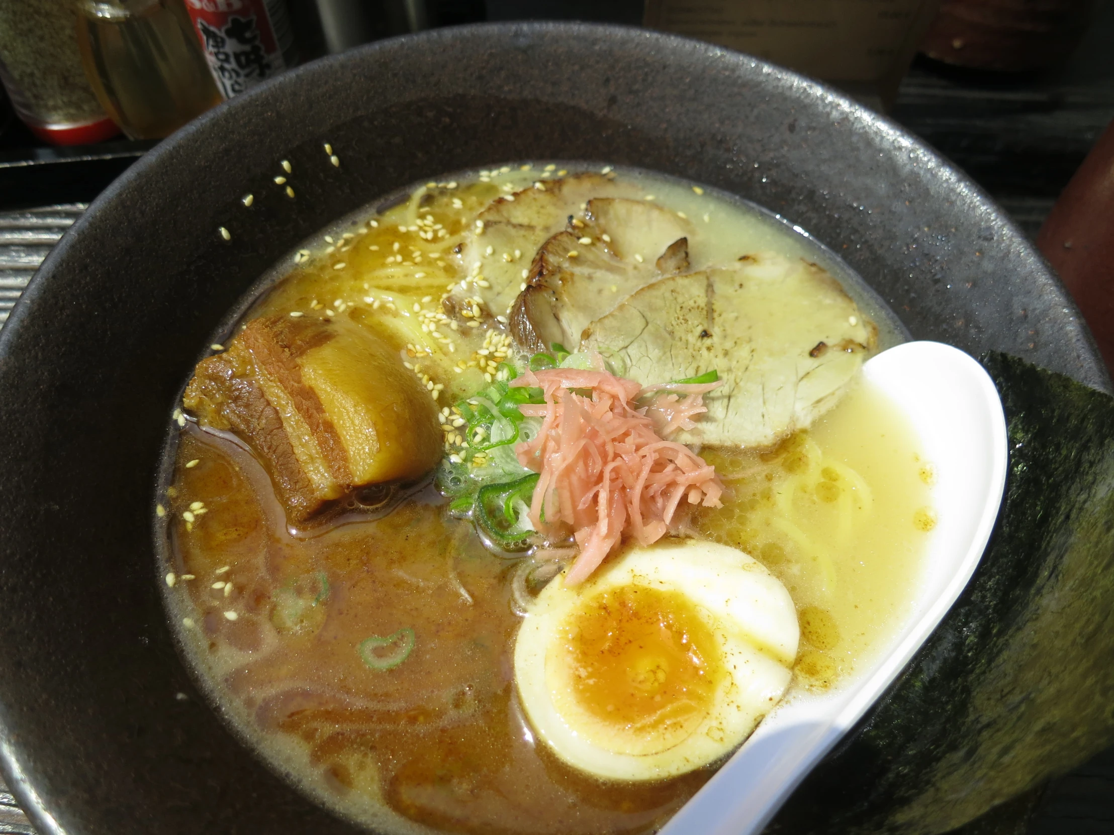 there is soup and eggs in a bowl