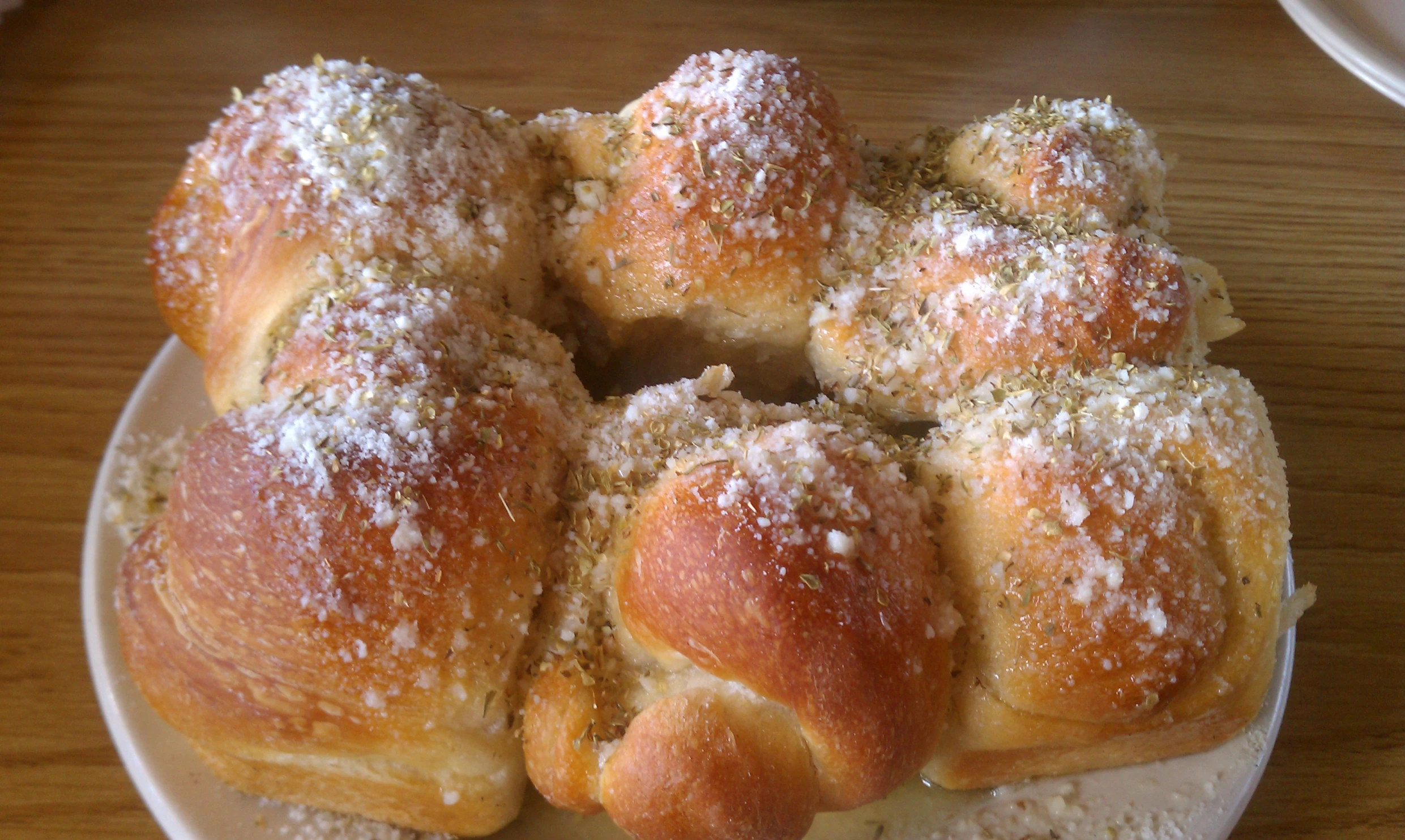 a plate with bread covered in powdered sugar