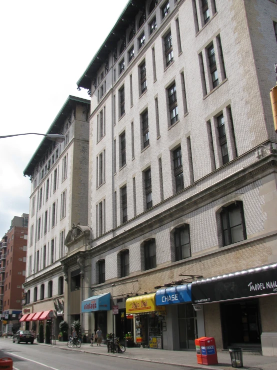 a street corner with buildings and shops in the city