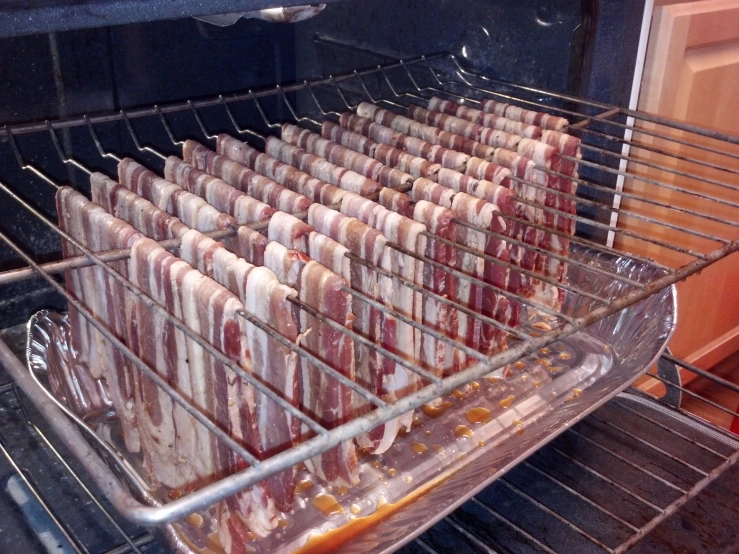 trays of stuffed meat sit in an oven