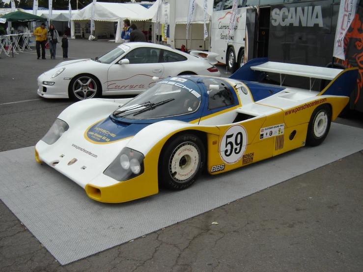 two sports cars are on display at the autosport competition