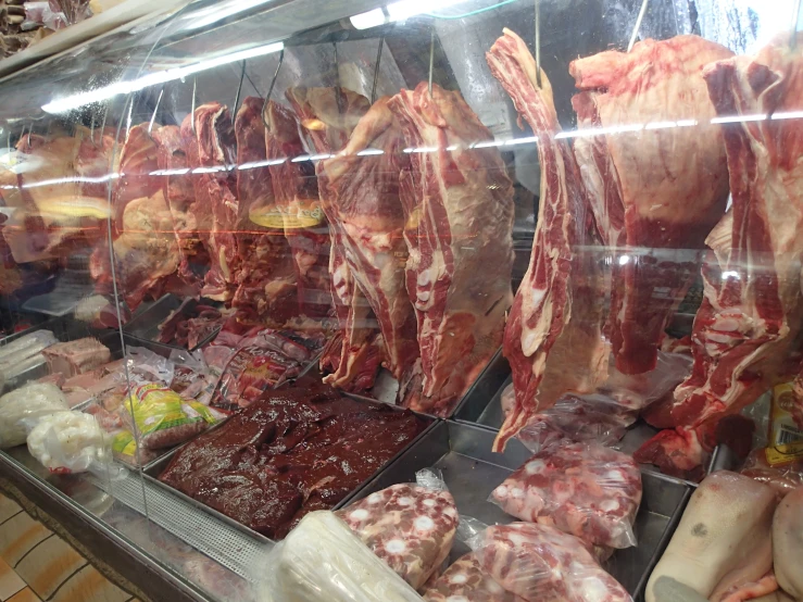 butcher's store with meats, sausage and meat - on - filets
