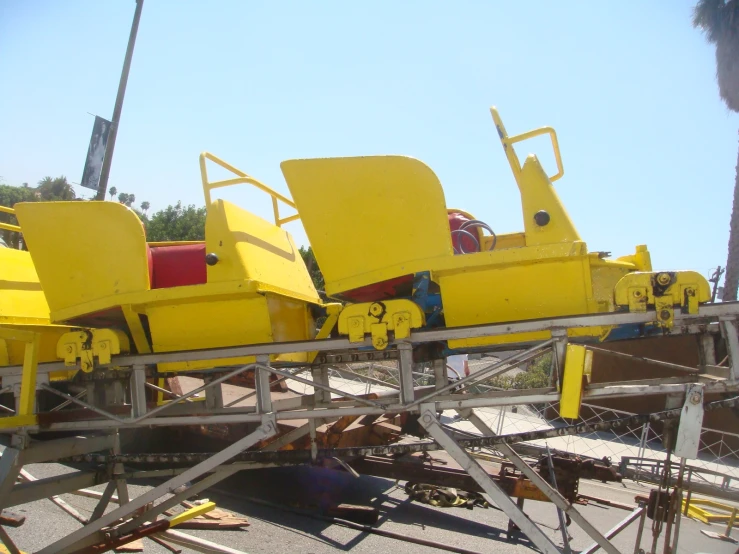 a roller coaster sitting on top of metal tracks