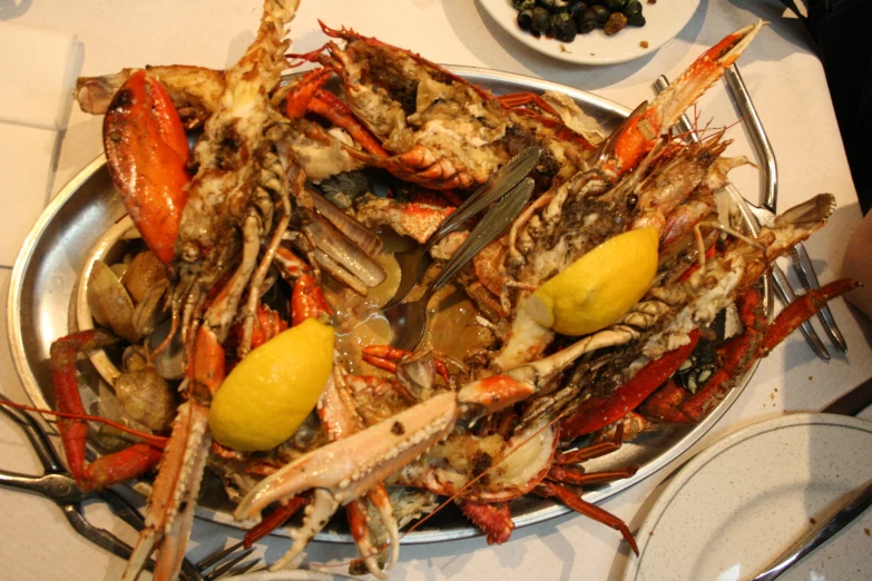 a bowl full of cooked and fried crabs