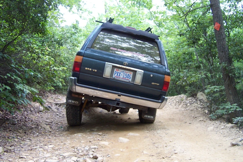 a truck that is sitting in the dirt