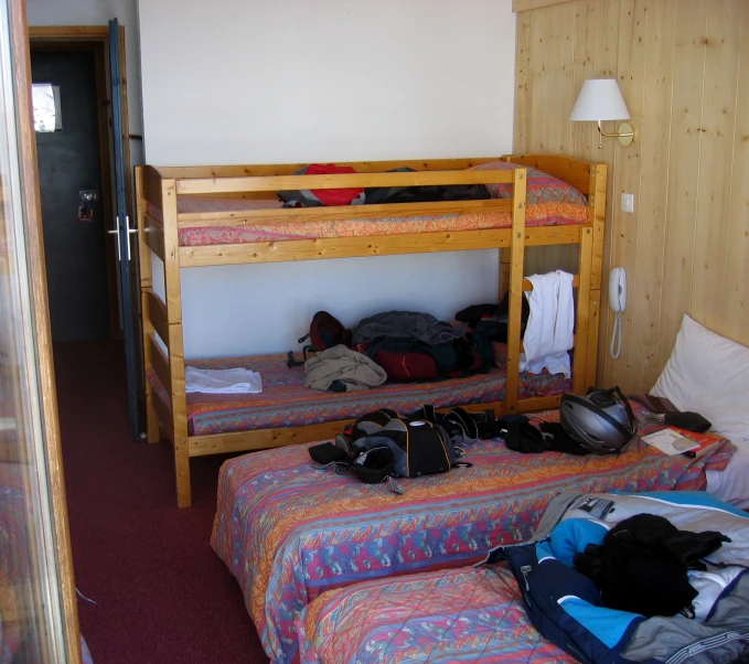 a room filled with two bunk beds sitting next to each other