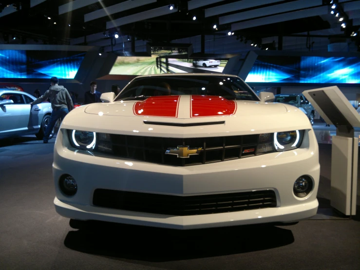 a car that is white and is on display