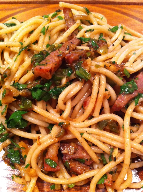 a plate filled with pasta and meat