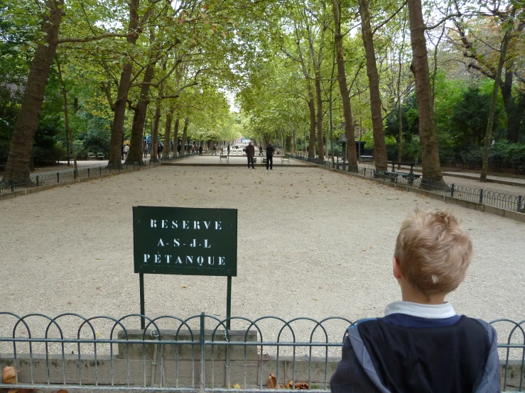 a  looks out across a park