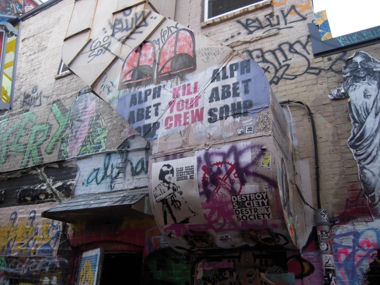 a close up view of a building covered in graffiti