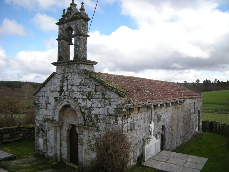 an old stone church with a large bell tower