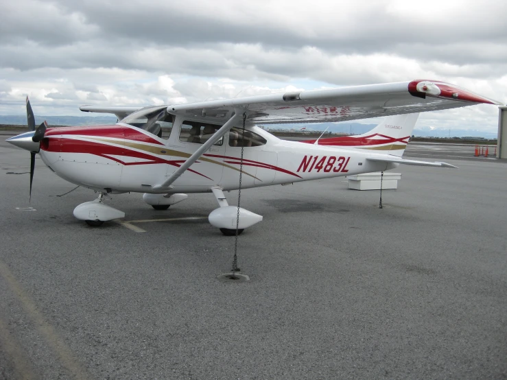 the small airplane sits on the tarmac ready for take off