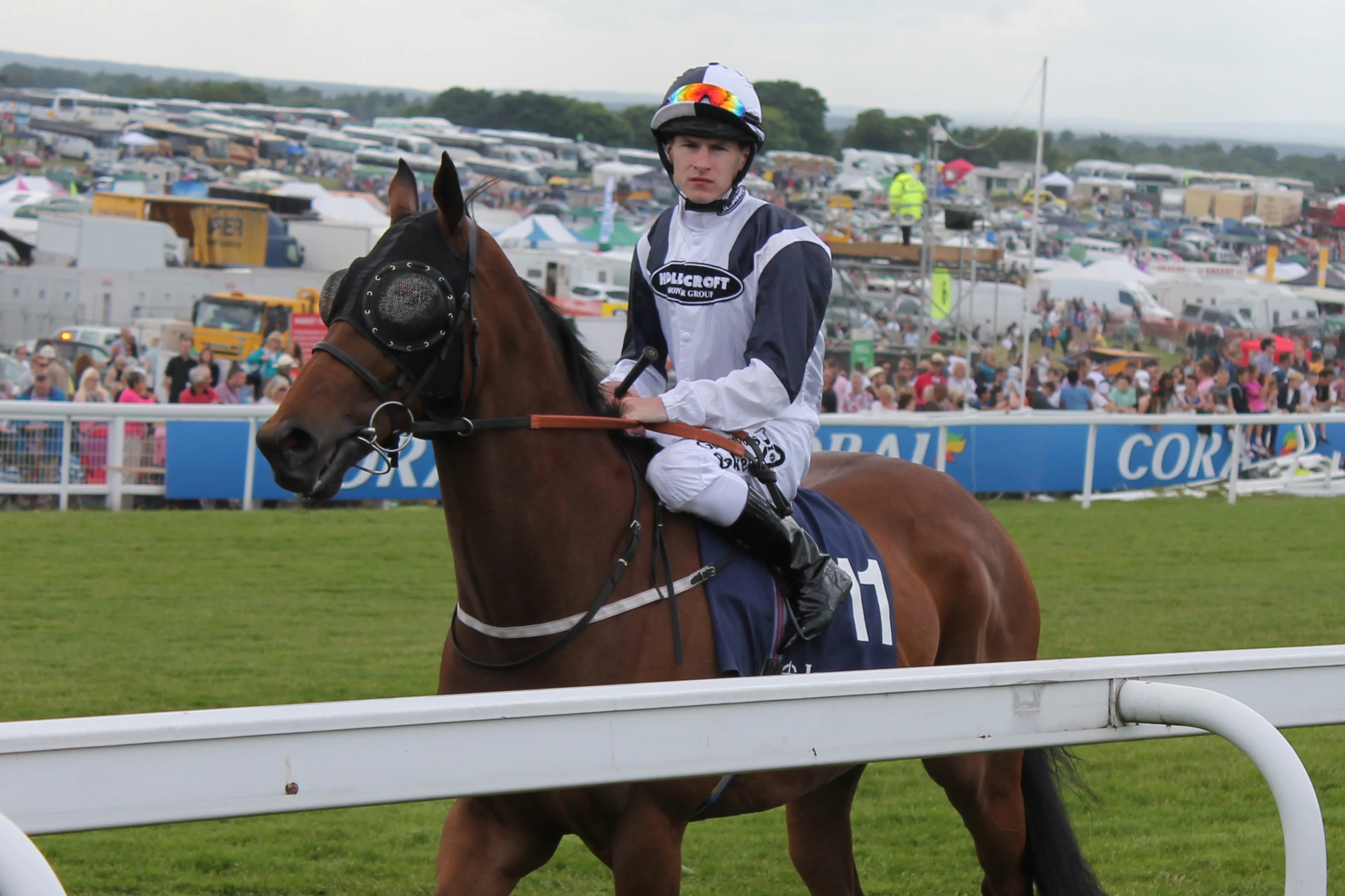 a jockey riding on the back of a horse