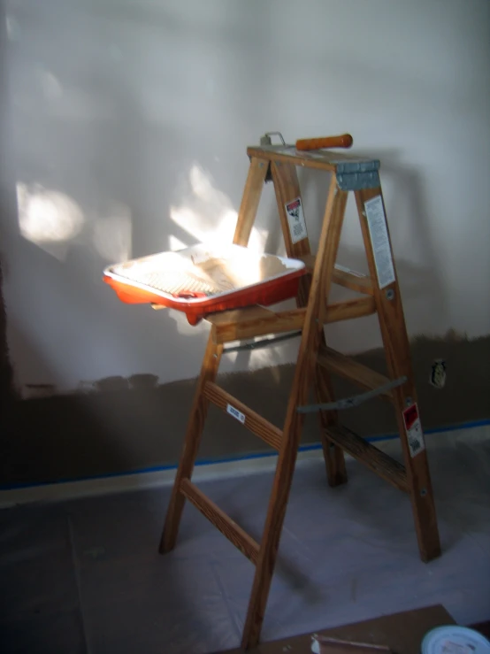 a chair with a book and paddle on top of it