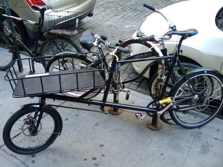 a bike with a basket attached to the rear wheel
